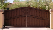 Arched decorative driveway gate; secure, private & beautiful entry