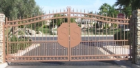 gated community entrance with the logo on the gates